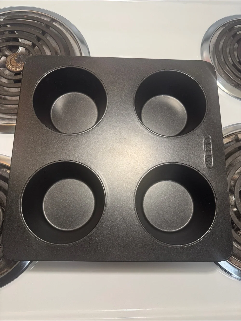 Two muffin pans, the large one is non-stick and NWOT. Small one is in GUC.